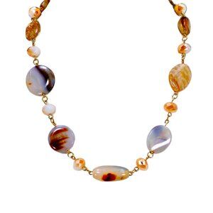 A mix of beige, brown, and off white bead necklace with glass and stone
